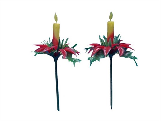 Candle with green and red leaves